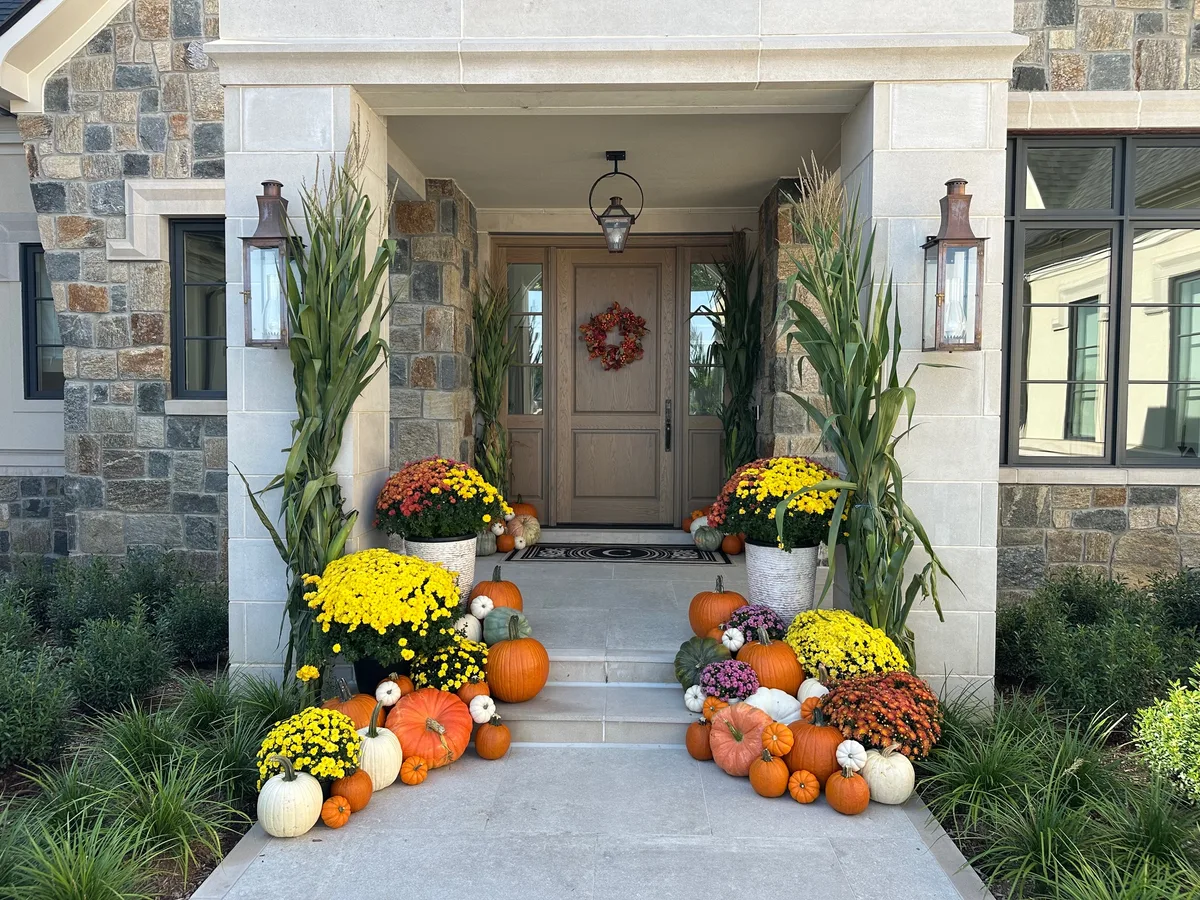 Professional pumpkin delivery and fall porch decorating in Troy MI with seasonal mums