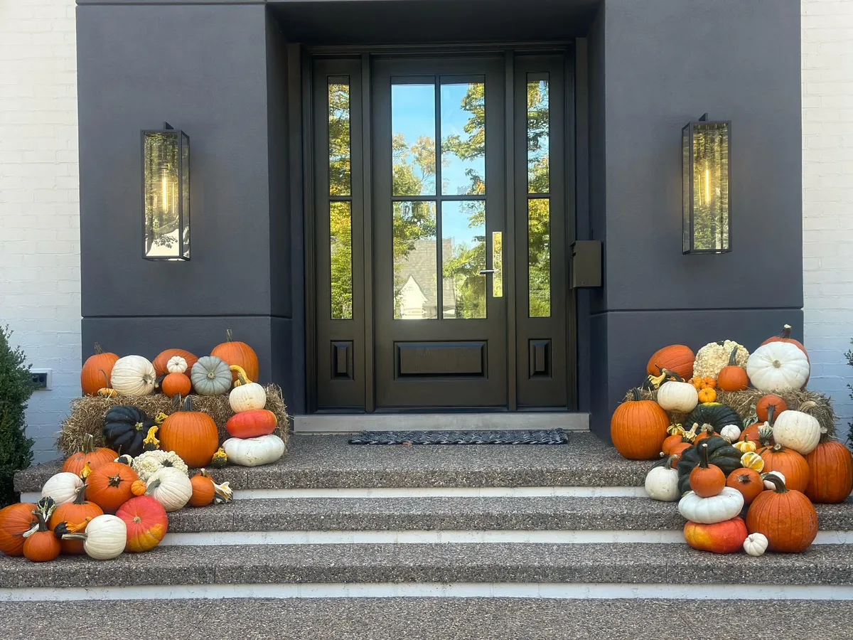 Patch display pumpkin delivery with hay bales in Bloomfield Township Michigan